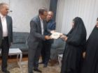 تکریم خانواده شهید اسدالله بهزاد اوخساری از شهدای جنگ تحمیلی سوم در نقده